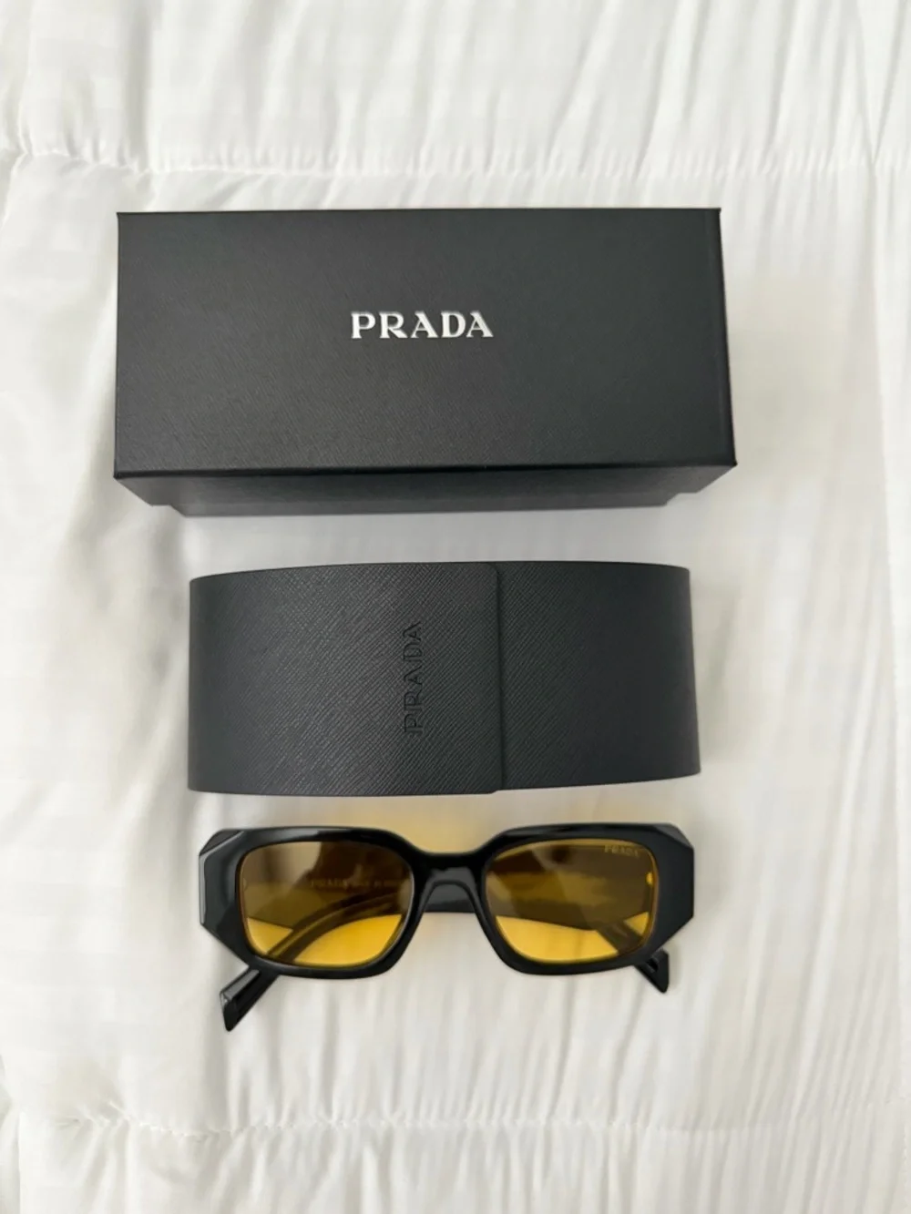 Prada Black Frame Sunglasses with Yellow Lenses - Picture 2 of 3